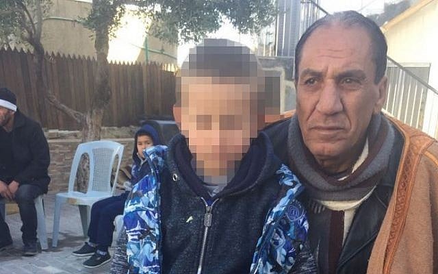 Relatives of Jerusalem terrorist Ibrahim Fadi al-Qunbar, in their home village of Jabel Muqabar, January 10, 2016 (Avi Issacharoff)