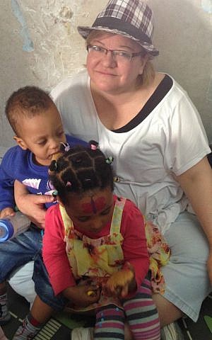 Julie Fisher volunteers at Elifelet: Citizens for Refugee Children NGO in Tel Aviv, March 2015. (Courtesy)