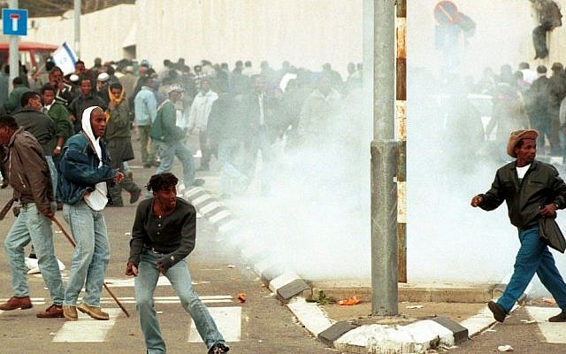 Police clash with Ethiopian Israelis taking part in a violent protest against what they say is police and government mistreatment, January 28, 1996. (Flash90) Police clash with Ethiopian Israelis taking part in a violent protest against what they say is police and government mistreatment, January 28, 1996. (Flash90)