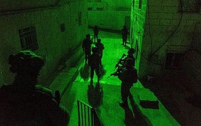 IDF troops make a late-night arrest in the West Bank on January 11, 2017. (IDF Spokesperson's Unit)