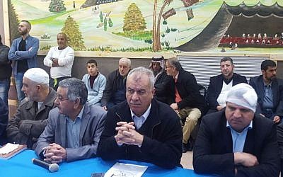 Joint List MKs Ayman Odeh (R) and Jamal Zahalka (2nd R) attend a meeting of the High Follow-Up Committee for Arab Citizens of Israel in Rahat on January 19, 2017 (courtesy)