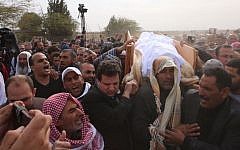 Joint (Arab) List leader MK Ayman Odeh holds the body of Yaqoub Mousa Abu Al-Qia’an, in a funeral that took place on January 24, 2017, near the village of Umm al-Hiran. (Joint List Spokesperson)