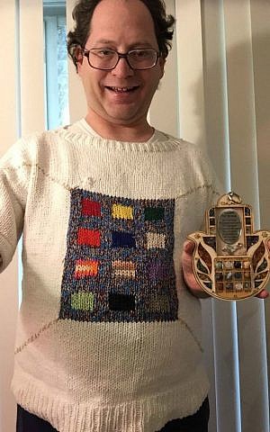 Baltimore knitter Sam Barsky displays his Yom Kippur-themed sweater featuring the High Priest's breastplate. (Courtesy/Facebook)
