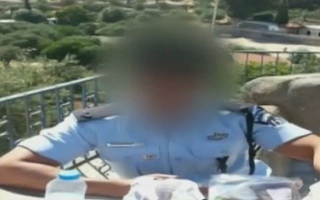 "A," a former Bedouin policeman, is shown in an undated photo with his face blurred out. A claims he was dismissed from the force recently due to the racist attitudes of his commanding officer (Channel 2 news) "A," a former Bedouin policeman, is shown in an undated photo with his face blurred out. A claims he was dismissed from the force recently due to the racist attitudes of his commanding officer (Channel 2 news)