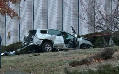 A reportedly stolen SUV that crashed into the side of the Congregation Beth El Keser Israel Synagogue in New Haven, Connecticut on January 2, 2016. (screen capture: FOX 61)