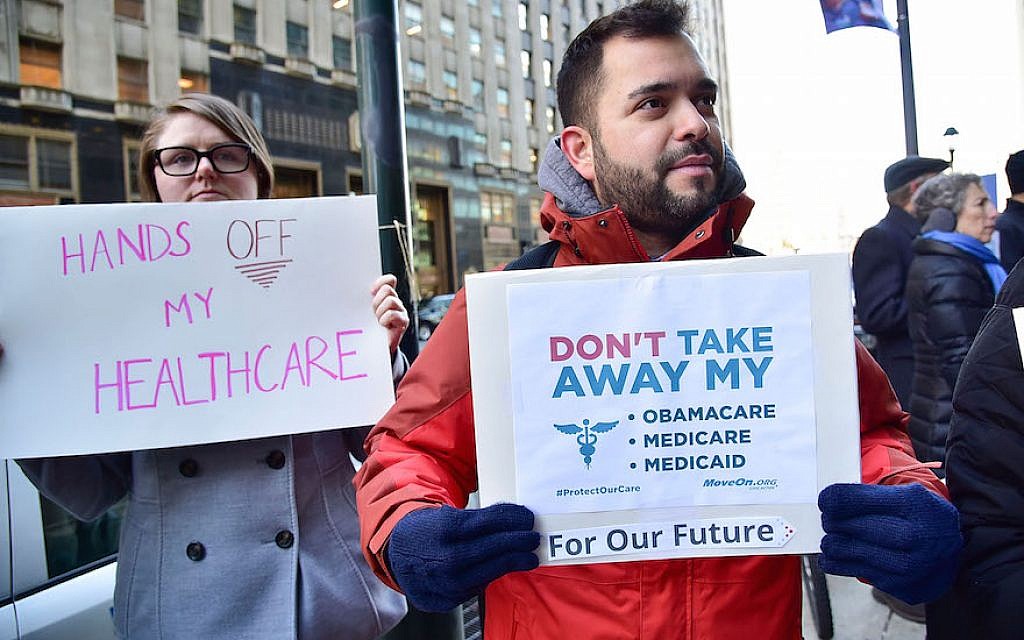 Constituents speak-out and rally supporting the Affordable Care Act, organized by MoveOn.org outside Senator Pat Toomey's office on December 20, 2016 in Philadelphia, Pennsylvania. (Photo by Lisa Lake/Getty Images for Moveon.org/ via JTA) Constituents speak-out and rally supporting the Affordable Care Act, organized by MoveOn.org outside Senator Pat Toomey's office on December 20, 2016 in Philadelphia, Pennsylvania. (Photo by Lisa Lake/Getty Images for Moveon.org/ via JTA)