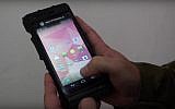 The IDF has developed a phone that supports both 4G and military networks and enables soldiers to securely send classified visuals and footage from the field. (YouTube screenshot)