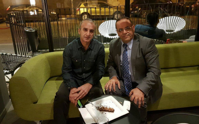 Minister-without-portfolio Ayoub Kara (right) meets with Ilan Hassin, whose son Ben is held in an unnamed Arab state on murder charges. (Screen capture: Facebook)
