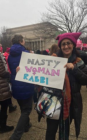 Rabbi Riqi Kosovske proudly holds her handmade sign at the Women's March on Washington, January 21, 2017. (Dina Kraft/Times of Israel)