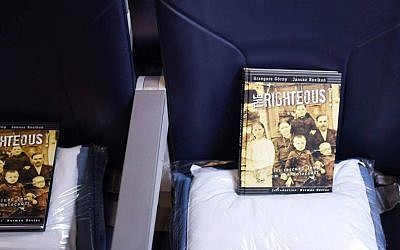 Books laid out for passengers of a LOT flight from Tel Aviv to Warsaw on Jan. 27, 2017 (Courtesy: From the Depths/JTA)