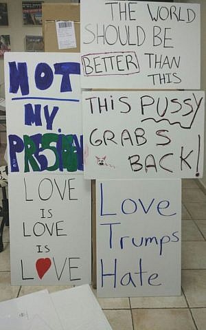 Posters prepared ahead of a January 21 rally outside the U.S. embassy in Tel Aviv the day after Donald Trump's inauguration (Courtesy)