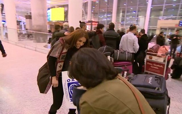 Rasha Elendari meeting her family at the airport in Canada after they were reunited thanks to the cooperation of a mosque and a synagogue in Toronto. (Screen capture CBC News) Rasha Elendari meeting her family at the airport in Canada after they were reunited thanks to the cooperation of a mosque and a synagogue in Toronto. (Screen capture CBC News)