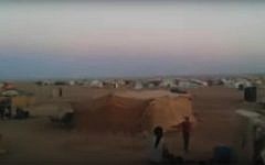 A still image from a July 2016 video showing Rukban refugee camp on the Syrian-Jordanian border (screen capture: YouTube)
