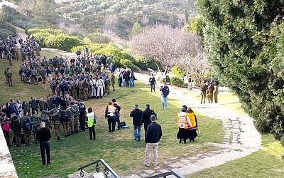Groups of soldiers receiving psycho-social support following a terror attack on January 8, 2017, on the Haas Promenade in Jerusalem, where a truck rammed into a group of soldiers on a tour. (Melanie Lidman/Times of Israel)