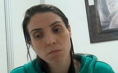 Clara Levi, the widow of police officer Erez Levi, talks to the media on January 19, 2017, the day after he was killed in a suspected car-ramming attack in the Bedouin village of Umm al-Hiran, (screen capture: Channel 2) 