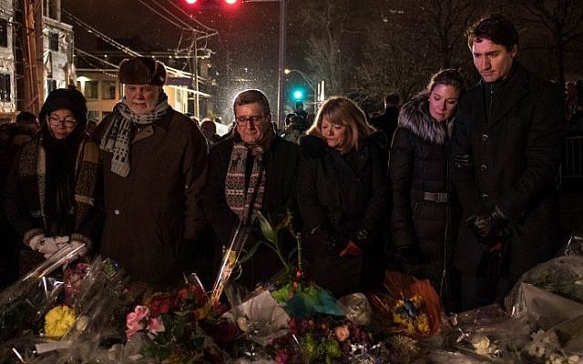 (L-R) Philippe Couillard's wife, Quebec prime minister Philippe Couillard, Quebec city mayor Regis Labeaume, his wife, Sophie Gregoire (Justin Trudeau's wife) and Canadian prime minister Justin Trudeau lay flowers near the Islamic Cultural Center in Quebec City, Canada on January 30, 2017. (AFP Photo/Alice Chiche) (L-R) Philippe Couillard's wife, Quebec prime minister Philippe Couillard, Quebec city mayor Regis Labeaume, his wife, Sophie Gregoire (Justin Trudeau's wife) and Canadian prime minister Justin Trudeau lay flowers near the Islamic Cultural Center in Quebec City, Canada on January 30, 2017. (AFP Photo/Alice Chiche)