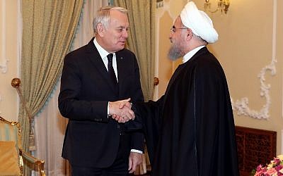 A handout picture provided by the Iranian Presidency shows Iran's President Hassan Rouhani(R)shaking hands with French Foreign Minister Jean-Marc Ayrault in Tehran on January 31, 2017. Ayrault voiced concern over a weekend ballistic missile test by Iran at a joint press conference with his Iranian counterpart. (AFP PHOTO / HO)