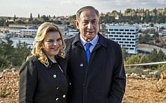Israeli Prime Minister Benjamin Netanyahu (R) and his wife Sara (L) attend a memorial ceremony for Ron Nahman, the founder of Ariel, one of the largest Israeli settlements in the West Bank on February 2, 2017 in Ariel. (AFP PHOTO / JACK GUEZ)