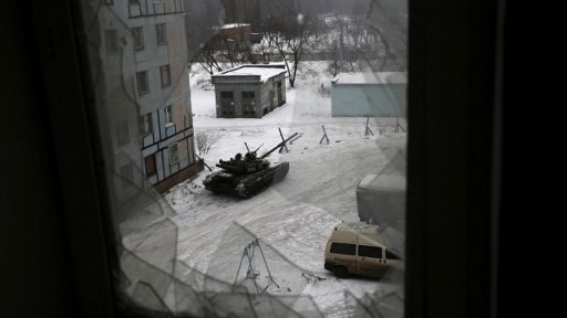 A tank from the Ukrainian Forces is stationed outside a building in the flashpoint eastern town of Avdiivka that sits just north of the pro-Russian rebels' de facto capital of Donetsk on February 2, 2017. (AFP PHOTO / Aleksey FILIPPOV) A tank from the Ukrainian Forces is stationed outside a building in the flashpoint eastern town of Avdiivka that sits just north of the pro-Russian rebels' de facto capital of Donetsk on February 2, 2017. (AFP PHOTO / Aleksey FILIPPOV)