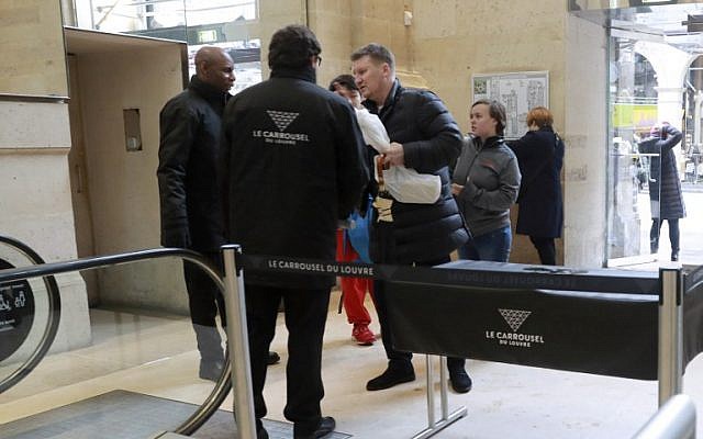 Tourists go through a security checkpoint as they enter the Carrousel du Louvre in Paris on February 4, 2017, a day after a machete-wielding attacker lunged at four French soldiers in a public area that leads to one of the Louvre Museum's entrances. (AFP/Jacques Demarthon) Tourists go through a security checkpoint as they enter the Carrousel du Louvre in Paris on February 4, 2017, a day after a machete-wielding attacker lunged at four French soldiers in a public area that leads to one of the Louvre Museum's entrances. (AFP/Jacques Demarthon)
