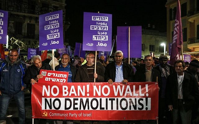 Arabs and Jews demonstrate against the government's demolition of illegally-built homes in the Arab community, in Tel Aviv on February 4, 2017. (AFP PHOTO/AHMAD GHARABLI) Arabs and Jews demonstrate against the government's demolition of illegally-built homes in the Arab community, in Tel Aviv on February 4, 2017. (AFP PHOTO/AHMAD GHARABLI)