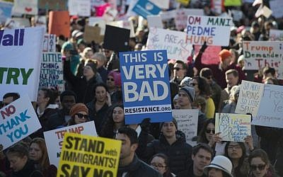 Protesters march on Pennsylvania Avenue while protesting against US President Donald Trump's recent action on refugees entering the US on February 4, 2017, in Washington, DC. (AFP Photo/Molly Rilley)