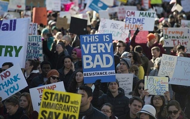 Protesters march on Pennsylvania Avenue while protesting against US President Donald Trump's recent action on refugees entering the US on February 4, 2017, in Washington, DC. (AFP PHOTO / MOLLY RILEY)