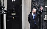 Prime Minister Benjamin Netanyahu waves to the media after arriving at 10 Downing Street in London for a meeting with British counterpart Theresa May on February 6, 2017. (AFP Photo/Chris J Ratcliffe)