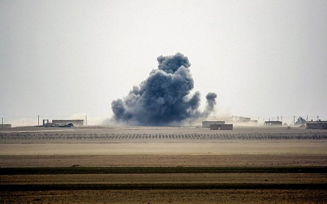 Smoke rises near the village of Bir Fawaz, north of Raqa, as members of the Syrian Democratic Forces, made up of US-backed Kurdish and Arab fighters, advance during their offensive towards the Islamic State group's Syrian stronghold as part of the third phase to retake the city and its surroundings, February 8, 2017. (AFP/DELIL SOULEIMAN)