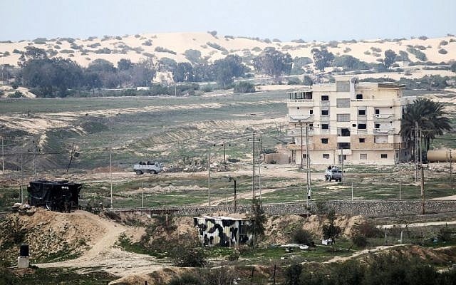 A picture taken from the southern Gaza Strip shows Egyptian soldiers patrolling the Egyptian side of the Rafah border crossing on February 9, 2017. (AFP/SAID KHATIB) A picture taken from the southern Gaza Strip shows Egyptian soldiers patrolling the Egyptian side of the Rafah border crossing on February 9, 2017. (AFP/SAID KHATIB)