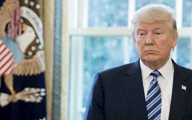 US President Donald Trump stands in the Oval Office of the White House in Washington, DC, February 9, 2017. (AFP/Saul Loeb) US President Donald Trump stands in the Oval Office of the White House in Washington, DC, February 9, 2017. (AFP/Saul Loeb)