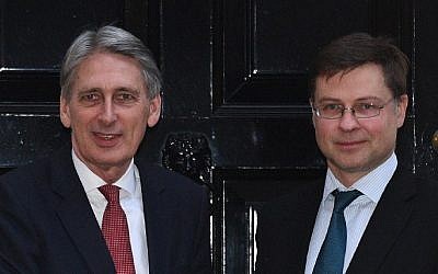 British Chancellor of the Exchequer Philip Hammond (L) is pictured with Vice President of the European Commission Valdis Dombrovskis outside 11 Downing Street in central London on February 9, 2017. (Justin Tallis/AFP)