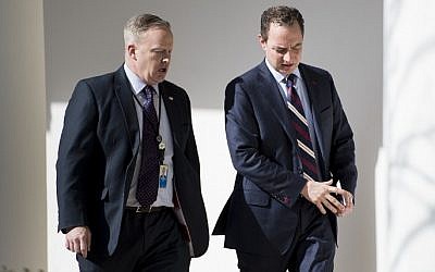 White House Press Secretary Sean Spicer, left, and White House Chief of Staff Reince Priebus walk through the colonnade of the White House in Washington, DC, February 10, 2017. (AFP/Brendan Smialowski)