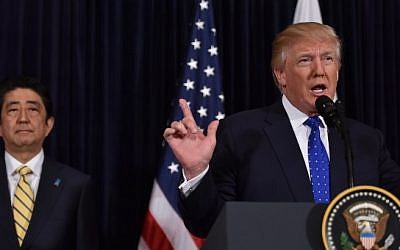 Japanese Prime Minister Shinzo Abe, left, and US President Donald Trump speak at Trump's Mar-a-Lago resort in Palm Beach, Florida, on February 11, 2017, after North Korea reportedly fired a ballistic missile, the first since Donald Trump became US president. AFP / Nicholas Kamm)