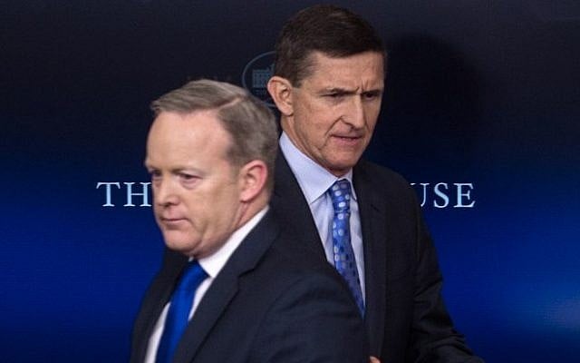This file photo taken on February 1, 2017 shows then-US National Security Adviser Mike Flynn (R) walking past Press Secretary Sean Spicer as he makes his way to the lectern during the daily press briefing at the White House in Washington, DC. (AFP / NICHOLAS KAMM)