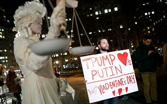 Demonstrators hold signs as the New York Immigration Coalition holds a rally and protest against US President Donald Trump in Foley Square in New York on February 14, 2017 (AFP PHOTO/EDUARDO MUNOZ ALVAREZ)