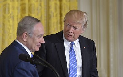 US President Donald Trump (R) welcomes Israeli Prime Minister Benjamin Netanyahu during a joint press conference at the White House in Washington, DC, February 15, 2017. (AFP/Mandel Ngan)