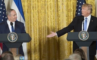 US President Donald Trump, right, and Israeli Prime Minister Benjamin Netanyahu hold a joint press conference in the East Room of the White House in Washington, DC, February 15, 2017. (AFP/ SAUL LOEB)