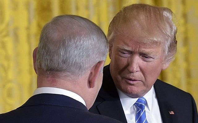 US President Donald Trump, right, Prime Minister Benjamin Netanyahu shake hands during a joint press conference in the East Room of the White House, in Washington, DC, February 15, 2017. (AFP PHOTO / MANDEL NGAN) US President Donald Trump, right, Prime Minister Benjamin Netanyahu shake hands during a joint press conference in the East Room of the White House, in Washington, DC, February 15, 2017. (AFP PHOTO / MANDEL NGAN)