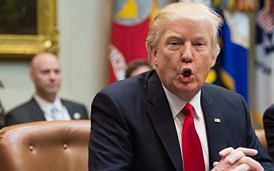 US President Donald Trump arrives at a meeting with members of Congress in the Roosevelt Room at the White House in Washington, DC, on February 16, 2017. (AFP Photo/Nicholas Kamm)