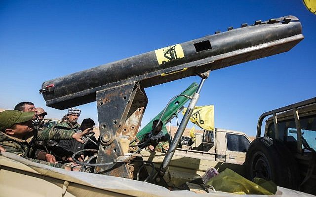 Fighters of the Hashed al-Shaabi (Popular Mobilization) paramilitaries sit in the back of a heavily-armed vehicle carrying a rocket launcher, at a defensive position on the outskirts of Tal Afar west of Mosul, where Iraqi forces are preparing for the offensive retake the western side of Mosul from Islamic State (IS) group fighters, on February 18, 2017. (AFP PHOTO / AHMAD AL-RUBAYE) Fighters of the Hashed al-Shaabi (Popular Mobilization) paramilitaries sit in the back of a heavily-armed vehicle carrying a rocket launcher, at a defensive position on the outskirts of Tal Afar west of Mosul, where Iraqi forces are preparing for the offensive retake the western side of Mosul from Islamic State (IS) group fighters, on February 18, 2017. (AFP PHOTO / AHMAD AL-RUBAYE)