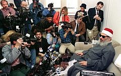 Sheikh Omar Abdel Rahman, the blind spiritual leader of Egypt's largest Islamic extremist fundamentalist group Gamaa Islamiya, faces photographers and reporters during a news conference in Jersey City on April 6, 1993. (AFP/Hai Do)