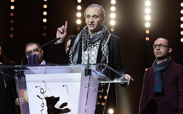 Palestinian director Raed Andoni speaks after beeing awarded with Glashuette Original Documentary Award during the Award Ceremony of the 67th Berlinale film festival in Berlin, February 18, 2017. (AFP/Tobias SCHWARZ) Palestinian director Raed Andoni speaks after beeing awarded with Glashuette Original Documentary Award during the Award Ceremony of the 67th Berlinale film festival in Berlin, February 18, 2017. (AFP/Tobias SCHWARZ)