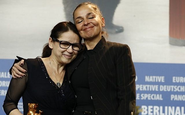 Hungarian director Ildiko Enyedi, left, poses after receiving the Golden Bear for Best Film 'On Body and Soul' with producer Monika Mecs at a press conference after the Award Ceremony of the 67th Berlinale film festival in Berlin, February 18, 2017. (AFP/Odd ANDERSEN)