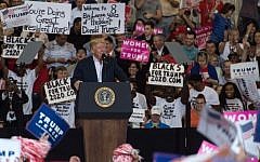 US President Donald Trump addresses a rally at the Orlando Melbourne International Airport on February 18, 2017 in Melbourne, Florida.  (AFP/ NICHOLAS KAMM)