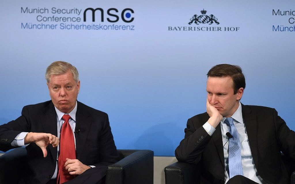 US Senator Lindsey Graham (L) gestures beside his compatriot US Senator Christopher Murphy (R) during a panel talk at the third day of the 53rd Munich Security Conference (MSC) at the Bayerischer Hof hotel in Munich, southern Germany, on February 19, 2017 (AFP PHOTO / Christof STACHE)