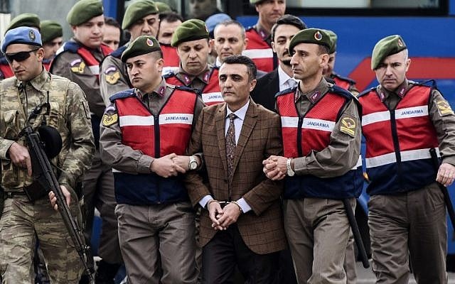 People, mainly Turkish soldiers, accused of trying to assassinate the Turkish president during the July coup attempt, are escorted by security forces towards the courthouse in Mugla, western Turkey, on February 20, 2017. (Bulent Kilic/AFP) People, mainly Turkish soldiers, accused of trying to assassinate the Turkish president during the July coup attempt, are escorted by security forces towards the courthouse in Mugla, western Turkey, on February 20, 2017. (Bulent Kilic/AFP)