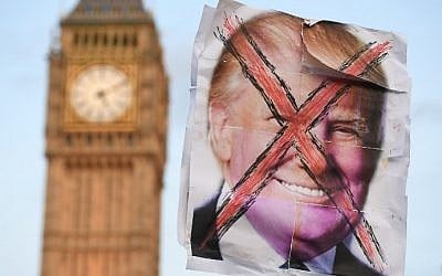 An anti-Trump placard is pictured near the Houses of Parliament during an anti-Trump demonstration in London on February 20, 2017. (AFP Photo/Justin Tallis)