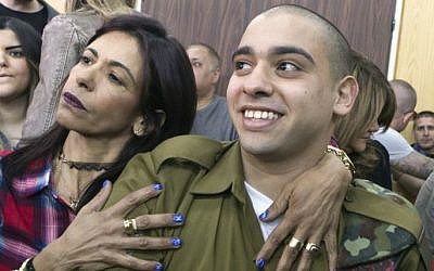 IDF soldier Elor Azaria, right, convicted on the manslaughter of a wounded Palestinian, is embraced by his mother Oshra at the start of his sentencing hearing in a military court in Tel Aviv, February 21, 2017. (AFP/Pool/Jim Hollander) IDF soldier Elor Azaria, right, convicted on the manslaughter of a wounded Palestinian, is embraced by his mother Oshra at the start of his sentencing hearing in a military court in Tel Aviv, February 21, 2017. (AFP/Pool/Jim Hollander)