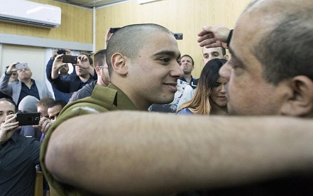 IDF soldier Elor Azaria, convicted on the manslaughter of a wounded Palestinian, at the start of his sentencing hearing in a military court in Tel Aviv, February 21, 2017. (AFP/POOL/ JIM HOLLANDER)